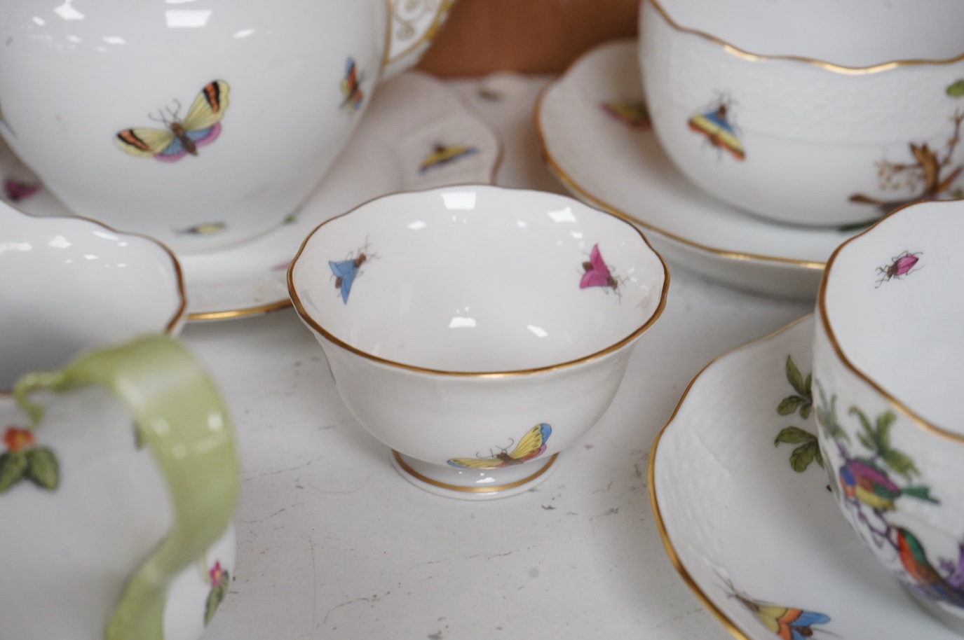 A Herend porcelain Rothschild Birds pattern tête-à-tête tea service, decorated with birds and butterflies. (8 piece's) teapot 10cm high
